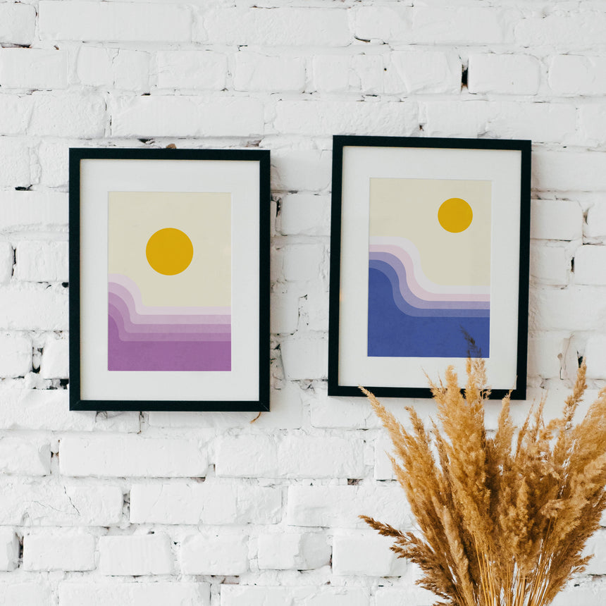 Retro horizon collection. Two framed artworks on a wall. Sunrise and sunset art prints.